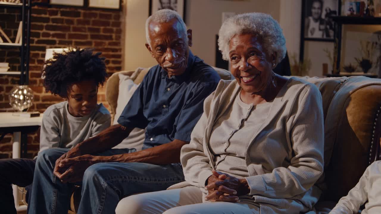 Warm, intimate video scene of a family conversation on a cozy couch