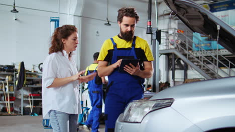 car mechanic listens to client request