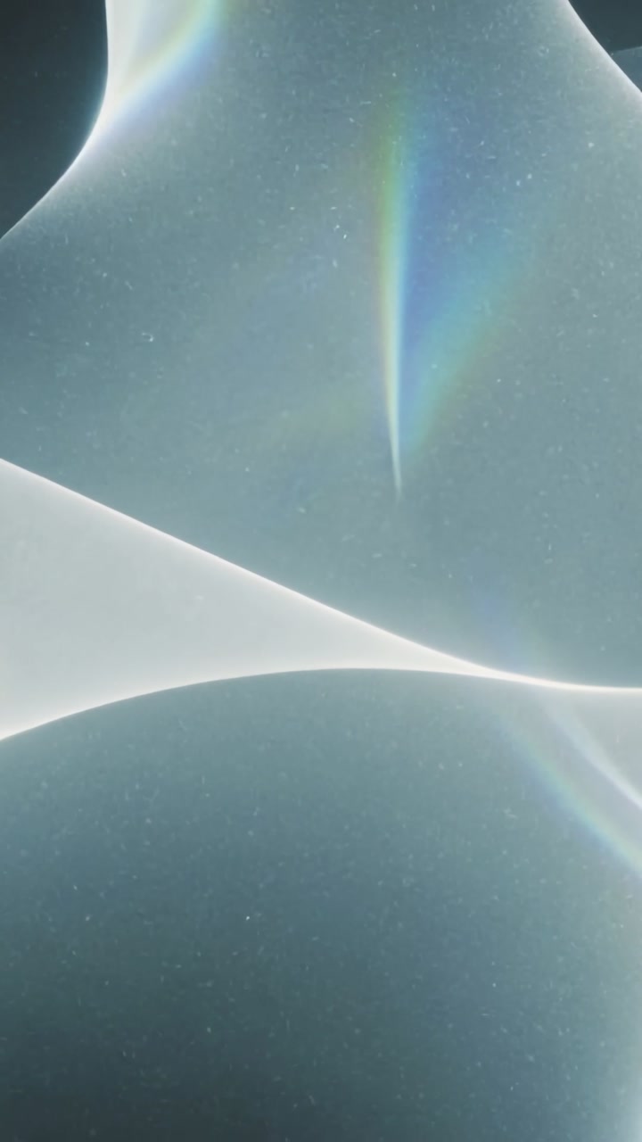 Vertical video: Shifting ribbon after frame shift on gradient, with prism streaks, specks