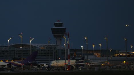 airplane landing at an airport at night