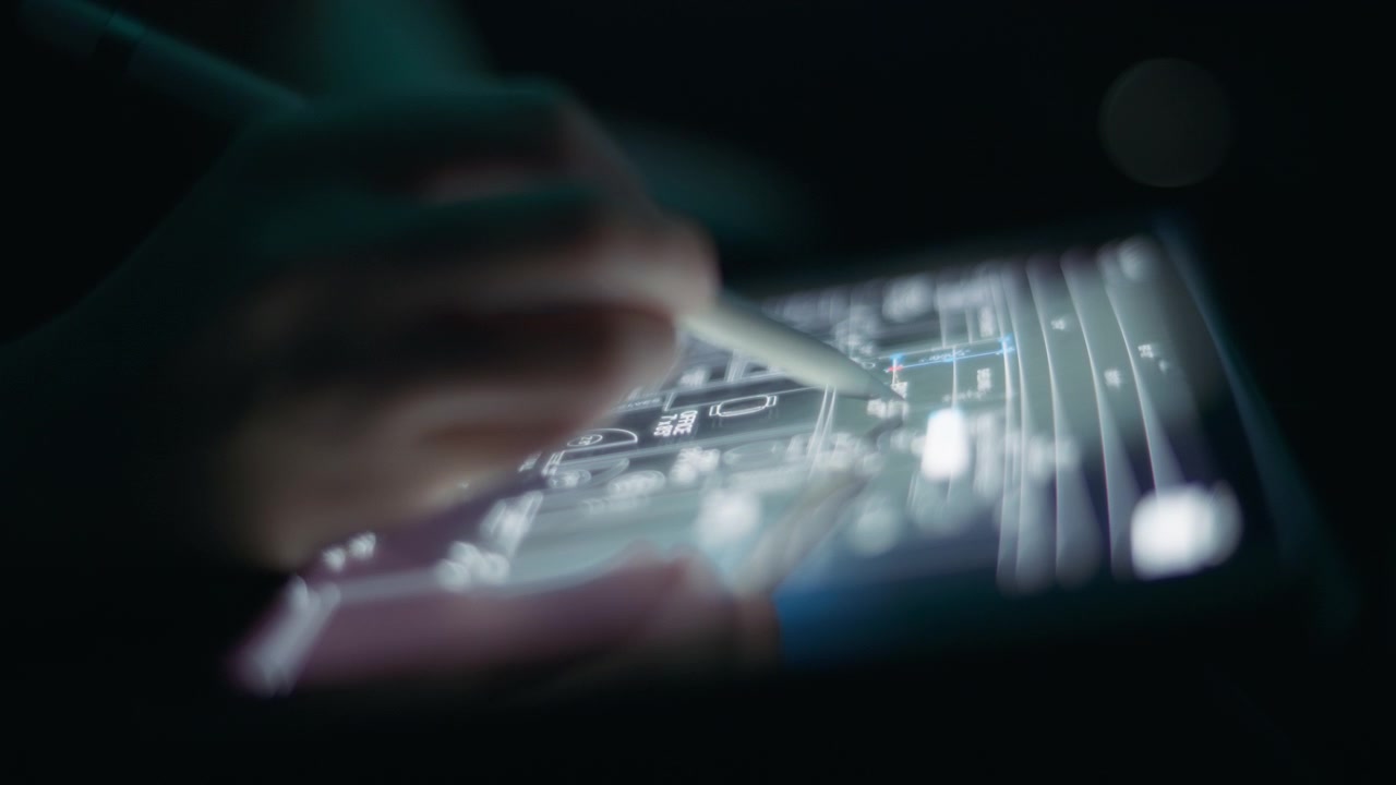 Architect drafting a house layout using a pen on a tablet