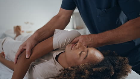 manual chiropractor treat patient in clinic. closeup woman visit physiotherapy