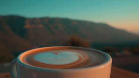 Coffee with Latte Art and a Mountain View