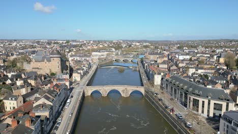 old bridge crossing mayenne river with laval castle