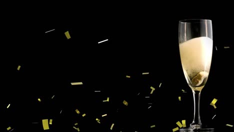 Animation-of-confetti-over-glass-of-champagne