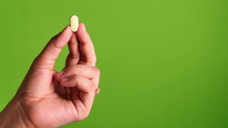 hand holding pills with copy space