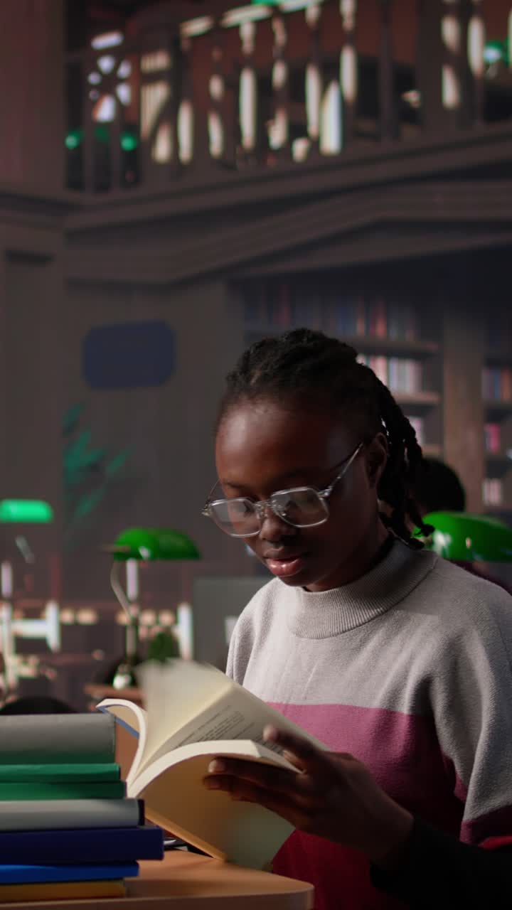 Vertical video african american girl does bachelor paper research for citations and information