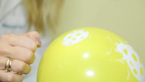 child checks eyesight in ophthalmological center. yellow ball closeup.