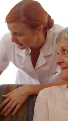 doctor talking to senior couple