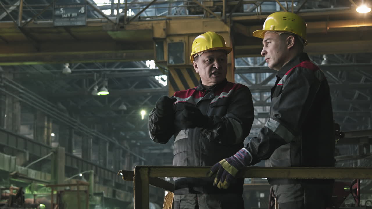 Plant Workers Having Conversation At Workplace