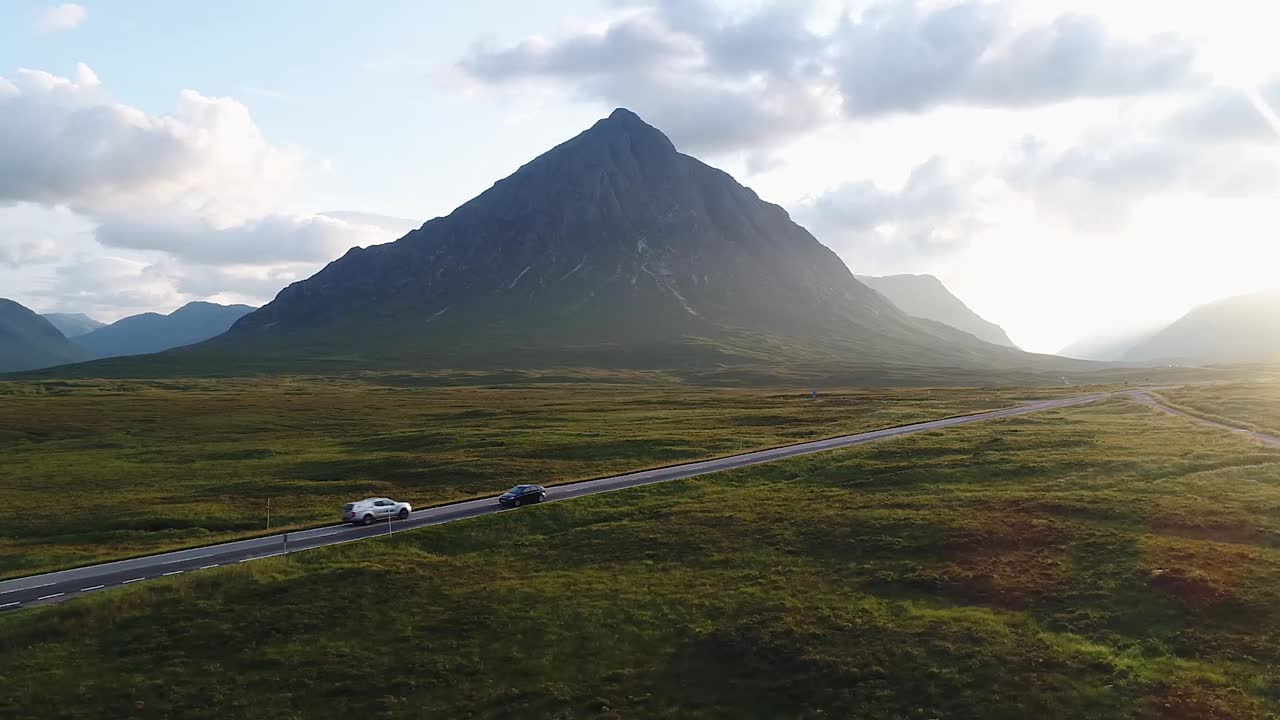 The incredible glencoe valley seen from the drone. This is the only road in this ancient volcanic area and it is surrounded by great mountains