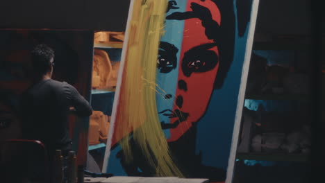 artist painting a colorful portrait