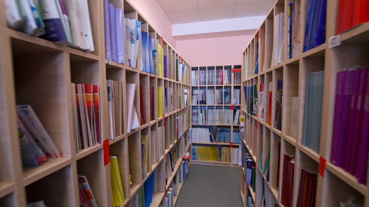 Bookshelves in university library. Interior of the library with shelves full of books