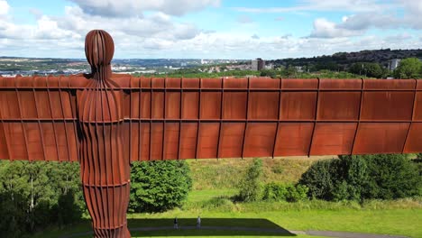 Close-aerial-view-of-the-Angel-of-the-North-statue,-to-a-wide-view