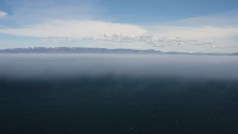 aerial - beautiful blue horizon above hvitserkur,vatnsnes, iceland, descending