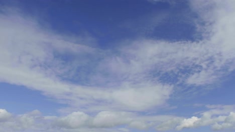 Time-lapse-of-clouds-against-blue-sky-moving-away