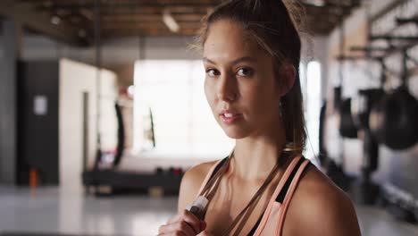 video of fit caucasian woman posing at gym