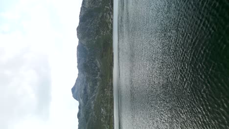 aerial flying over dam wall to reveal reservoir at grimsel pass