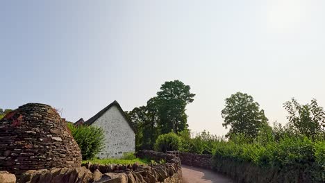 a peaceful path through lush greenery and stone walls