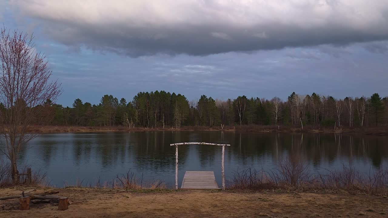 Wooden Dock with White Arch and Vacant Pond, Wide Timelapse Shot