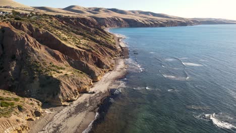 Flight-over-beautiful-calm-beach-looking-towards-the-Fleurieu-Peninsula,-South-Australia