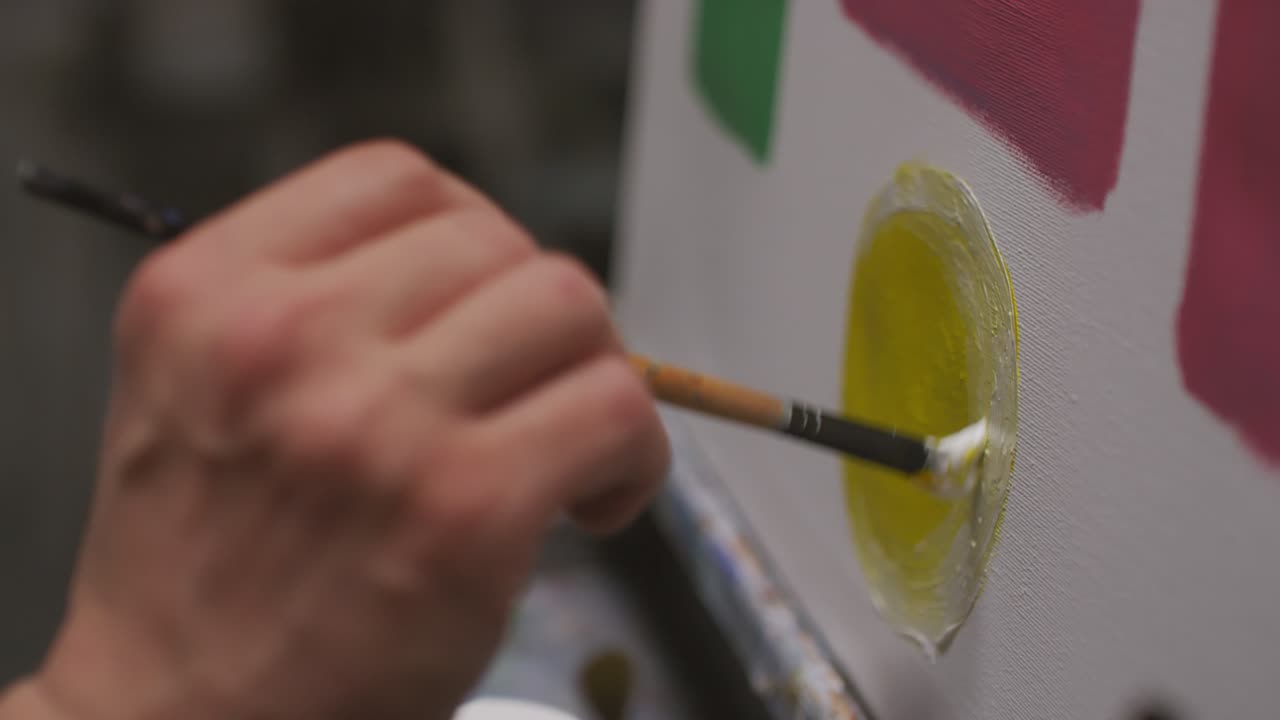 Artist Painting Strokes On Canvas