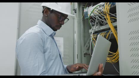it engineer working on network equipment