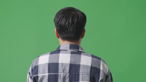 back view close up of asian man walking in green screen background