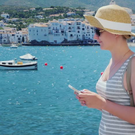 a woman rests by the sea near cadaques in catalonia 5