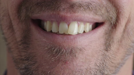 caucasian-man-mouth-smiling-happy-teeth-with-unshaved-facial-hair-stubble-cheerful-expression-close-up