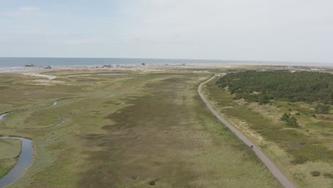 drone - aerial shot of the green nature beach of st. peter ording at the north sea, schleswig holstein, germany, 25p