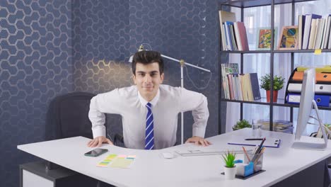 Office-worker-doing-push-ups-and-exercises-leaning-on-the-table.