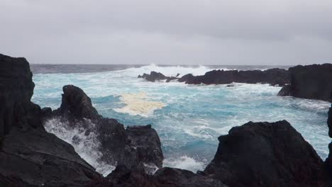 stormy weather and dramatic sea in biscoitos natural pool