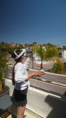 woman using vr headset on a balcony