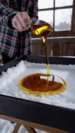 making maple syrup taffy on snow