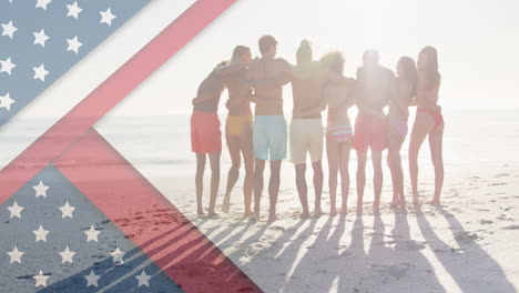 animación de la bandera estadounidense sobre un grupo diverso de amigos abrazándose en la playa