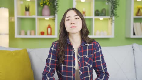 Beautiful-Asian-young-woman-looking-at-camera-with-a-dull-expression.