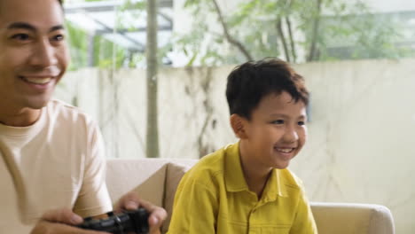 Asian-man-and-boy-in-the-living-room