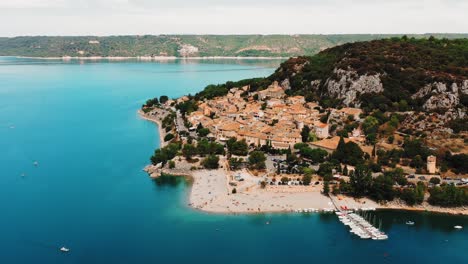 moving aerial view of a sleep town beside the gorges du verdon