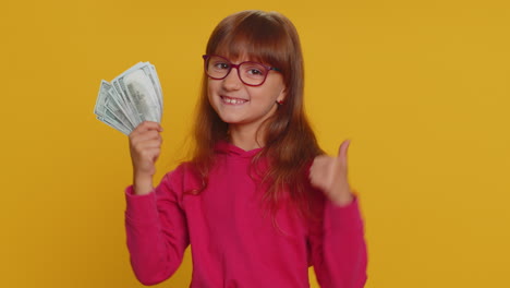 Rich-pleased-girl-child-kid-waving-money-dollar-cash-bills,-success,-lottery-winner,-income,-wealth