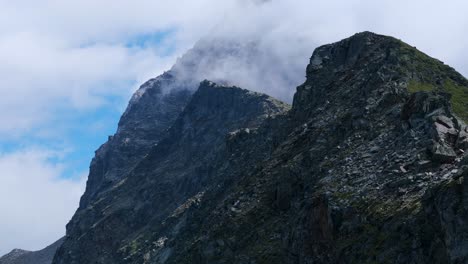 Impressive-low-angle-view-of-clouds-over-Valmalenco-mountain-peaks-in-Northern-Italy-in-summer-season