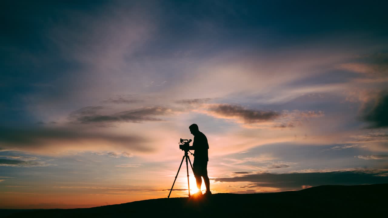 Photographer capturing a sunset silhouette
