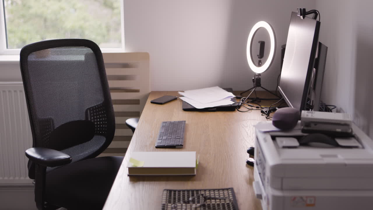 Office desk setup with computer, chair, and office supplies