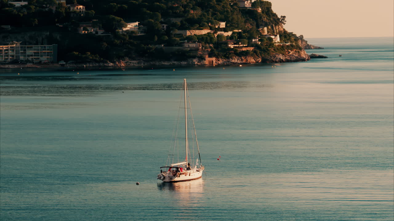 Boats docked on the sea in Ligurian Sea in Villefranche-sur-Mer, France