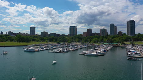 Aerial-view-over-boats-at-the-McKinley-Marina-in-sunny-Milwaukee-city,-WI,-USA