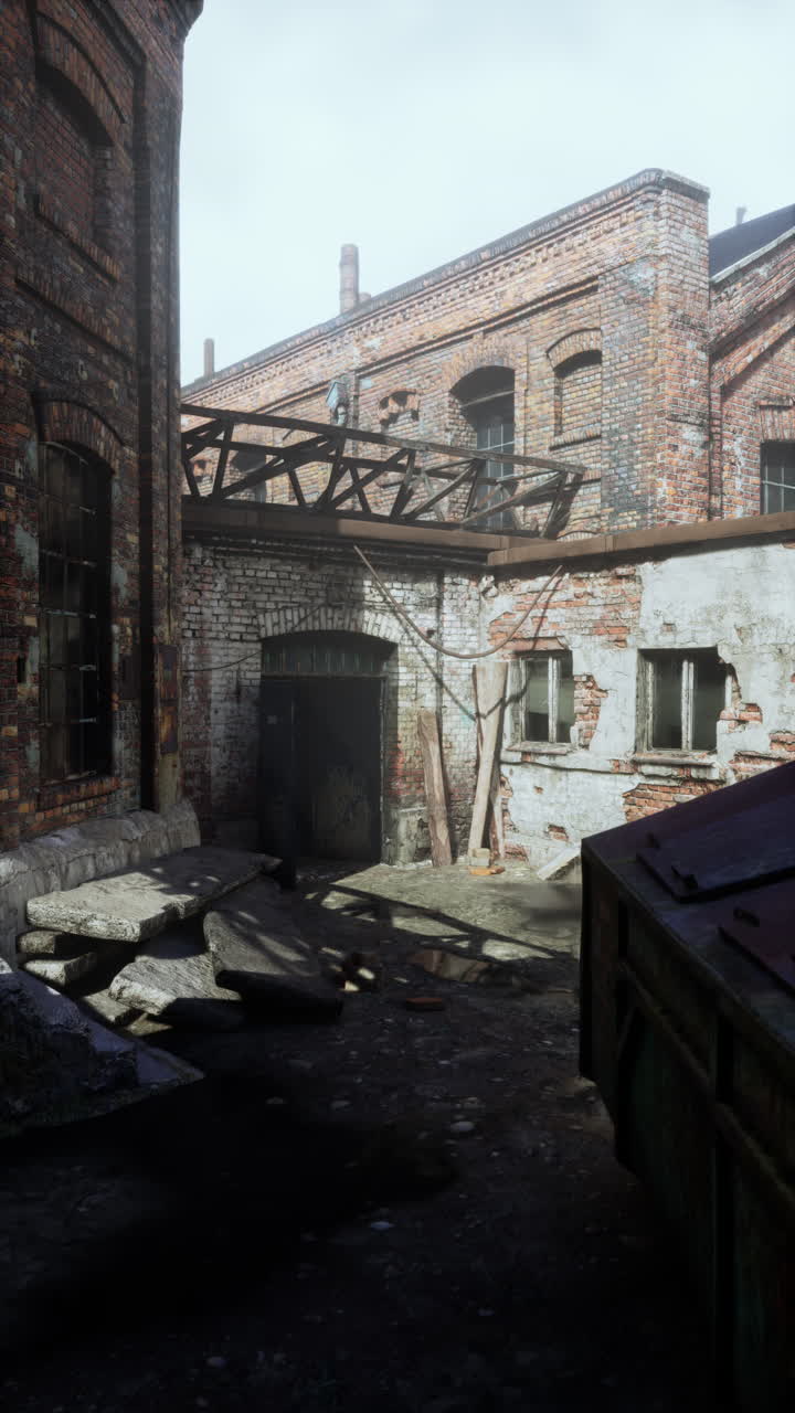 Weathered factory with numerous windows vertical