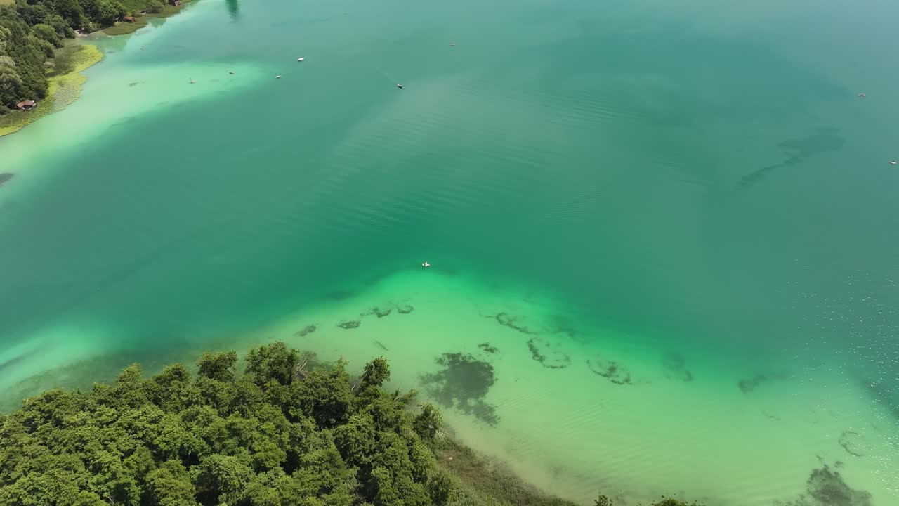 Aerial view Hallwil in Canton Aargau, Switzerland, lush green shoreline, Seetal countryside, calm clear water and natural beauty