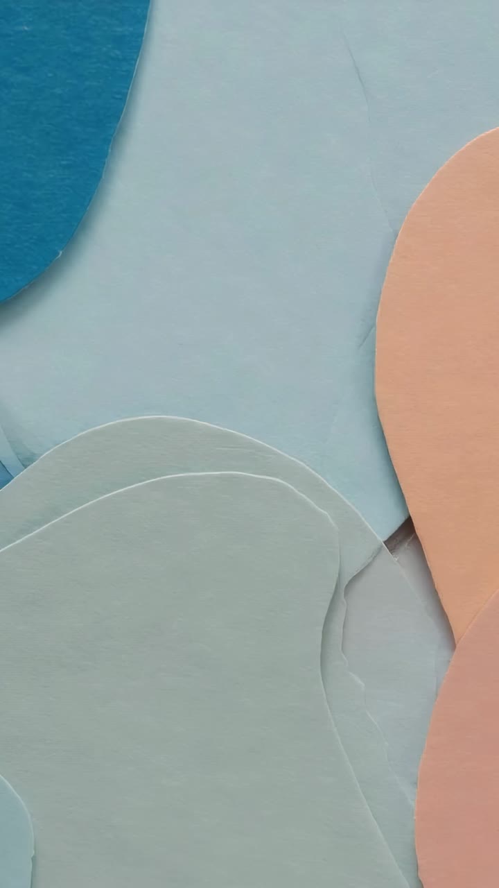 Vertical video: Black fluid form emerging after pastel shapes forming backdrop, sweeping layers off