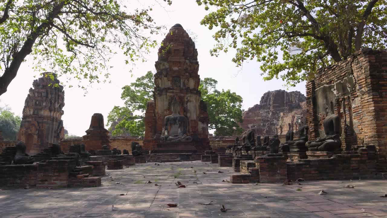 Stone buddha statue and scenery at Buddhist temple in Ayutthaya, Thailand
