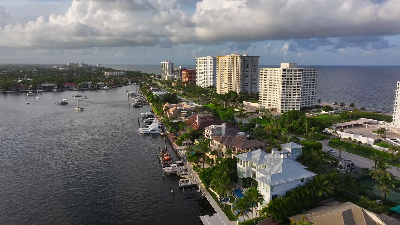 Aerial View of Coastal City with Luxury Waterfront Homes and High-Rise Buildings